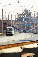 Image showing Road, traffic and cars by harbor, shipyard and urban infrastructure for transport, shipping or industry. Outdoor, street and driving for export, travel or city at port, distribution and global trade