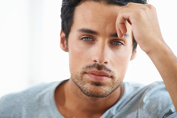 Image showing Serious man, closeup and face of handsome model or resting hand on head on isolated and white background. Portrait of Spanish male person, clean skin or facial aesthetic with confidence and blue eyes