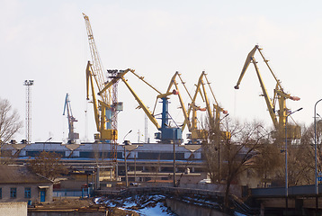 Image showing Harbor, port and crane for shipping, outdoor and buildings for industry, manufacturing and supply chain. Urban shipyard, machine and equipment for trade, export and infrastructure for distribution