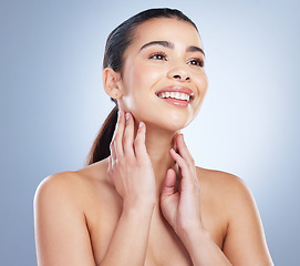 Image showing Smile, skincare and hands on face of woman in studio for wellness, glowing skin or cosmetic satisfaction on grey background. Beauty, soft and asian lady model happy with dermatology, luxury or result