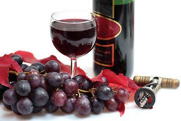 Image showing Glass of red wine and grapes