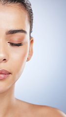 Image showing Makeup, half and face of woman in studio for cosmetics, glamour and treatment on grey background. Beauty, wellness and asian female skin model with eyeshadow, foundation and luxury glow satisfaction