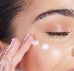 Image showing Skincare, closeup and woman with cream on face, anti ageing and collagen treatment for skin glow. Dermatology, cosmetics and morning beauty routine, facial lotion on model with moisturiser product.