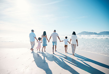 Image showing Travel, beach and big family walking on vacation together at the sea or ocean bonding for love and happiness. Happy, sun and parents with children or kids and grandparents on holiday for freedom