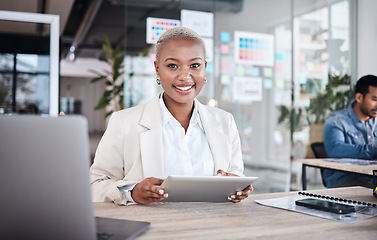 Image showing Portrait of happy woman at desk in coworking space with tablet, laptop and work at design agency. Business, smile and African girl in office with online report in digital career at tech startup job.