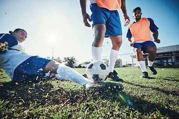 Image showing Football, slide and men with action, grass and health with workout goal, fitness and motion. Male players, guys and athlete with a challenge, soccer and sports with competition, training and fast