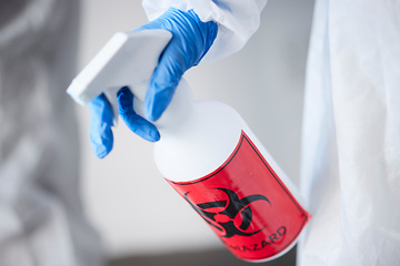 Image showing Hazmat suit, spray bottle and gloves for biohazard, covid and stop virus for safety, protection or test in laboratory. Person, science and cleaning with chemical, liquid and ppe for bacteria in room