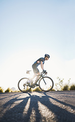 Image showing Mountain, sports and male cyclist cycling on bicycle training for a race or marathon in nature. Fitness, workout and man athlete riding a bike for cardio exercise on an outdoor off road trail.