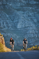 Image showing Mountain, fitness and male athletes cycling on bicycles training for a race or marathon in nature. Sports, workout and men cyclists riding a bike for cardio exercise on an outdoor off road trail.