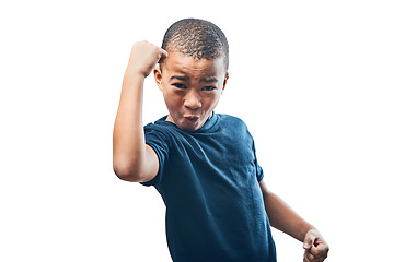 Image showing Happy boy, portrait and fist in celebration for achievement standing isolated on a transparent PNG background. Little child, kid or teen in celebrate, winning or power for success, prize or bonus