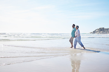 Image showing Beach, walking and senior couple holding hands for bonding, quality time and relax in nature. Love, retirement and happy elderly man and woman by ocean on holiday, vacation and travel in morning