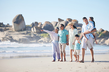 Image showing Travel, beach and family and children walking by sea for bonding, quality time and relaxing in nature. Grandparents, travel and happy mom, dad and kids by ocean on holiday, vacation and adventure