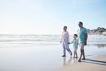 Image showing Beach, walking and senior couple with boy for bonding, quality time and relaxing in nature. Family, travel and happy elderly man and woman with child by ocean on holiday, vacation and adventure