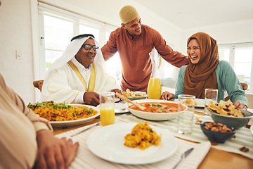 Image showing Food, lunch and muslim with big family at table for eid mubarak, Islamic celebration and happy. Ramadan festival, culture and iftar with people eating at home for fasting, islam and religion holiday