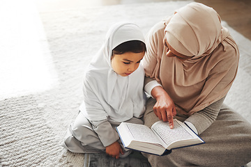 Image showing Quran, Islamic and mother and child prayer to Allah, god or holy spirit for Arabic religion, faith and learning to pray. Spiritual worship book, home Muslim family and praying mom teaching young kid