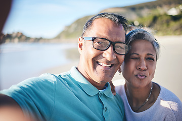 Image showing Senior couple, beach selfie and portrait with smile, pouting lips and happy for vacation, summer and memory. Mature man, woman and outdoor with photography, profile picture and ocean for social media