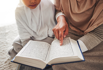 Image showing Quran, Muslim child or parent hands reading for learning, Islamic knowledge and faith in Allah, god or culture. Spiritual books, home closeup or Arab person teaching kid worship, prayer or gratitude