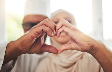 Image showing Love, Muslim or senior couple with heart hands for support, trust and care in retirement, bonding or marriage. Emoji icon, Islamic home or Arab man, woman and elderly people together for quality time