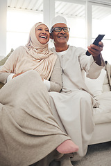 Image showing Relax, muslim and watching tv with old couple on sofa for streaming, movie and funny. Television, smile and happy with senior man and woman in living room at home for comedy, retirement and lounge