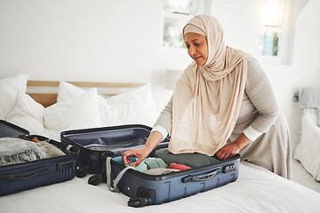 Image showing Travel, bedroom and Muslim woman with suitcase packing for holiday, vacation and religious trip. Home, luggage and Islamic female person with clothes in bag prepare for journey, adventure and tourism