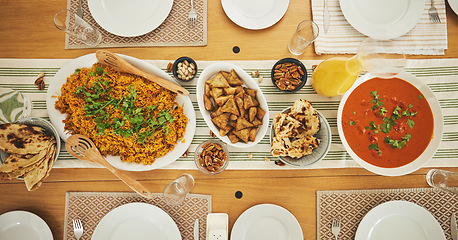 Image showing Food, Eid Mubarak and above of lunch for family at table for Islamic celebration, festival and dinner. Ramadan, religion and top view of feast, meal and cuisine for fasting, holiday and culture