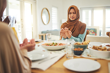 Image showing Food, prayer and muslim with family at table for eid mubarak, Islamic celebration and lunch. Ramadan festival, culture and iftar with people praying at home for fasting, islam and religion holiday