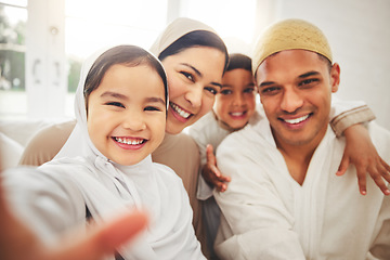 Image showing Selfie, Islam and happy family in living room for Eid with mom, dad and kids with home culture in Indonesia. Muslim man, woman in hijab and children in portrait to celebrate Ramadan on sofa together.