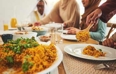 Image showing Food, closeup and muslim with big family at table for eid mubarak, Islamic celebration and lunch. Ramadan festival, culture and iftar with people eating at home for fasting, islam or religion holiday