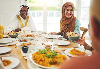 Image showing Food, help and muslim with big family at table for eid mubarak, Islamic celebration and lunch. Ramadan festival, culture and iftar with people eating at home for fasting, islam and religion holiday