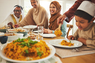 Image showing Food, islam and muslim with big family at table for eid mubarak, Islamic celebration and lunch. Ramadan festival, culture and iftar with people eating at home for fasting, happy and religion holiday