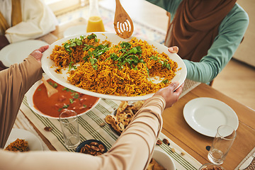 Image showing Culture, Eid Mubarak and food for family at table for Islamic celebration, festival and lunch together. Ramadan, religion and above of hands with meal, dish and cuisine for fasting, holiday and feast