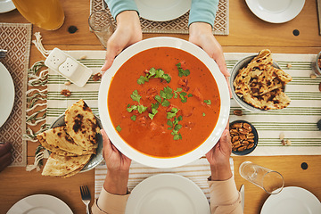 Image showing Food, Eid Mubarak and dish for family at table for Islamic celebration, festival and lunch together. Ramadan, religion and above of hands with meal, feast and cuisine for fasting, holiday and culture