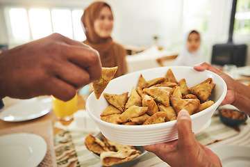 Image showing Food, samosa and muslim with hands of people at table for eid mubarak, Islamic celebration and lunch. Ramadan festival, culture and iftar with closeup of family at home for fasting, islam or religion