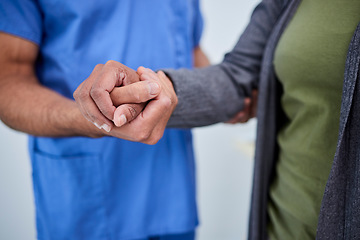 Image showing Closeup, hands and doctor with a patient, support and solidarity with treatment, comfort and empathy. Zoom, medical professional and woman with test results, healthcare and help with hope and trust