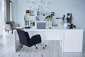 Image showing Empty, office of medical doctor and consultation with furniture, table or professional layout of hospital interior. Background, consulting room or workplace in healthcare, surgery and wellness clinic