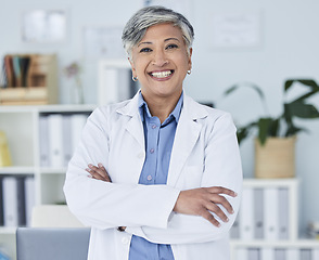 Image showing Happy senior woman, portrait and doctor with arms crossed in confidence for healthcare at the office. Excited, confident and mature female person or medical professional with smile at the clinic