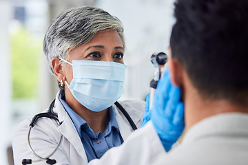 Image showing Woman, doctor and face mask with patient for exam, checkup or healthcare appointment at hospital. Female person or medical professional with protection checking ill or sick man with flu at clinic