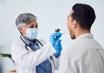 Image showing Woman, doctor and face mask with patient for checkup, exam or healthcare appointment at the hospital. Female person or medical professional with protection checking ill or sick man with flu at clinic
