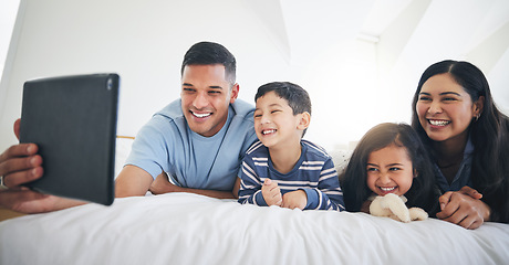 Image showing Digital tablet, video call and happy family in bed relax, smile and bond with online communication. Bedroom, selfie and children with parents for profile picture or photo in their home on the weekend