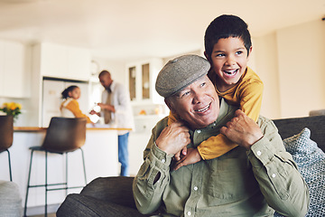 Image showing Home, grandfather and boy relax, hug and happiness with love, family and quality time in the lounge. Male child, happy grandpa and kid embrace, bonding and care with joy, playful and weekend break