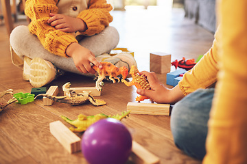 Image showing Children are playing with toys, fun and fantasy with friends or siblings at home, bonding and childhood. Relax, playful together and young people on floor with games, adventure and childcare at house