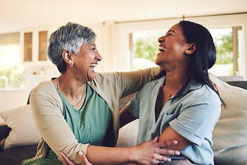 Image showing Funny, senior mother and hug daughter in home, bonding and laughing together. Happy, elderly mom and embrace woman, relax and smile with care, love and enjoying time on living room sofa with family.