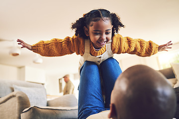 Image showing Young girl, father and playing, airplane and flying with freedom, bonding and happiness at home. People in living room, family house and relax, care free and playful with games, fun and man with kid