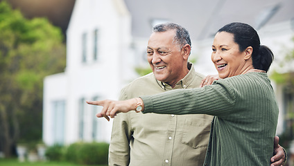 Image showing Happy, pointing and a senior couple in nature for a holiday, travel or break in retirement. Smile, love and an elderly man and woman with a gesture in a backyard or neighborhood lawn for the view