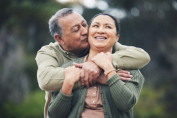 Image showing Hug, kiss and senior couple in nature, thinking and love during retirement together. Happy, idea and an elderly man and woman with affection in a garden or park for support or care in marriage