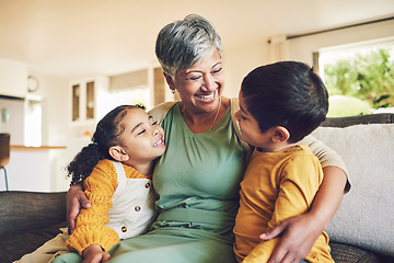 Image showing Hug, grandmother or happy kids on a sofa with love enjoying quality bonding time together in family home. Smile, affection or funny senior grandparent with children siblings on house couch laughing