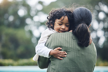 Image showing Love, trust and child hug mother at outdoor park bonding for care and happy for quality time together in nature. Smile, mama and kid embrace parent or mom for happiness and support in mockup space