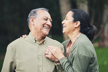 Image showing Love, talk and mature couple in nature in an outdoor park with care, happiness and romance. Happy, smile and senior man and woman in retirement embracing and bonding together in a green garden.