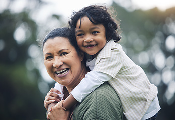 Image showing Funny face, grandmother and piggyback kid at park, nature or outdoor on vacation. Portrait, happy and grandma carrying child, bonding and laughing, care and enjoying quality time together with bokeh.