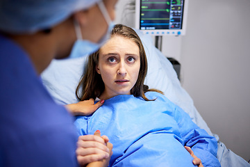 Image showing Pregnant woman, hospital and labor with push, holding hands or midwife at bed, baby and talking. Strong mother, childbirth and nurse with helping hand, advice and care for healthy delivery in clinic